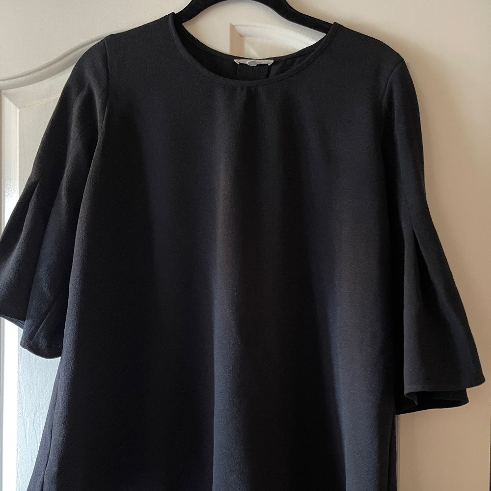 Black tunic with bell sleeves and back pleat